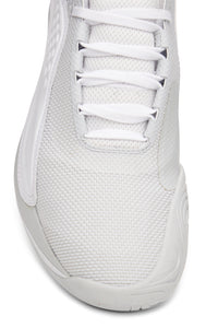 A pair of white FILA Mondo Forza tennis shoes with orange and grey accents on a white background.