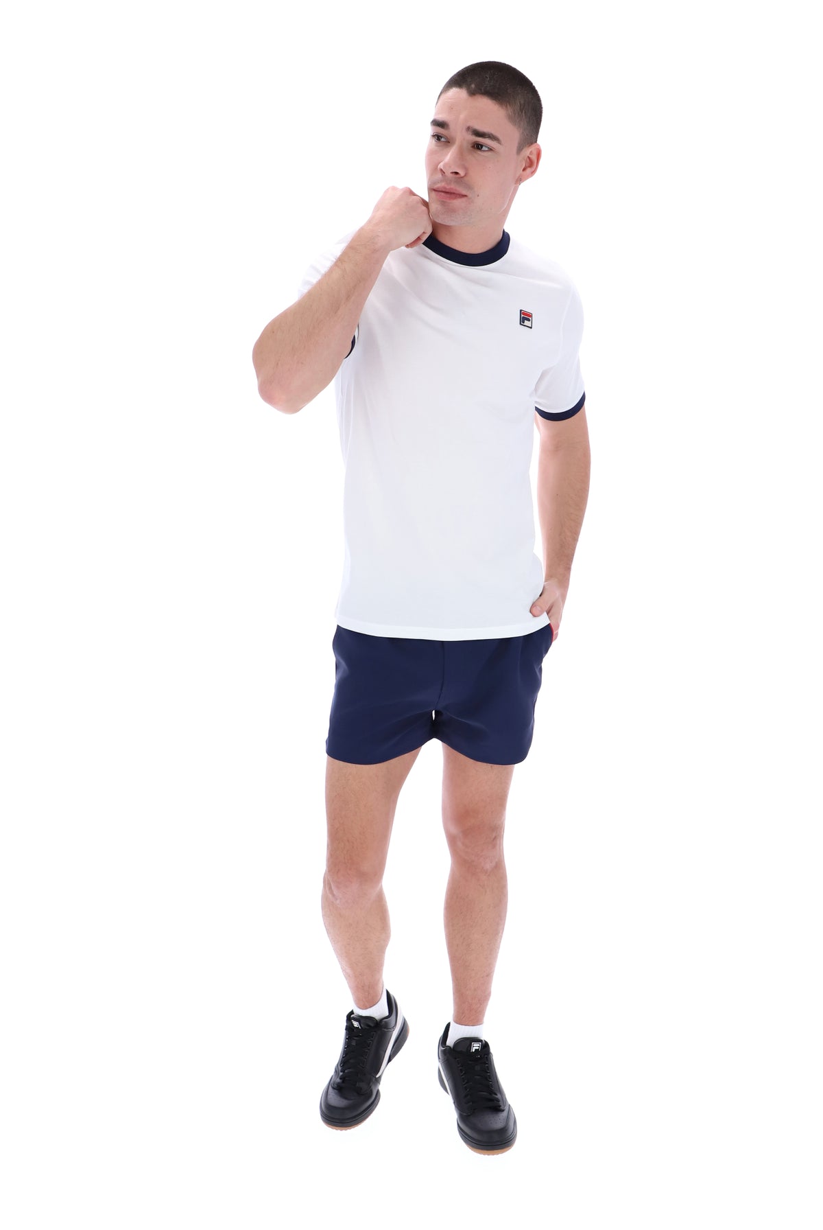 Displays a model wearing the White 'Fila' branded Marconi Essential Ringer T-Shirt