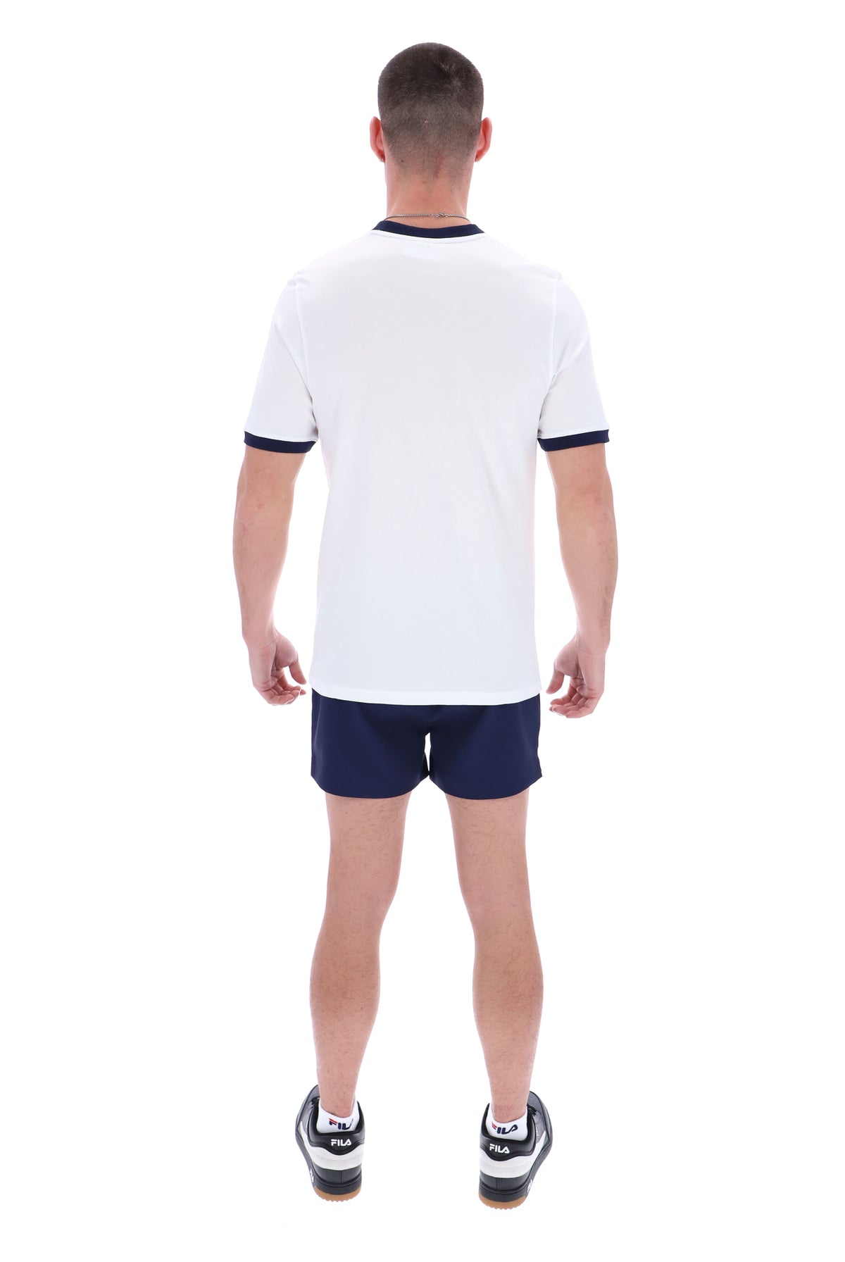 Displays a model wearing the White 'Fila' branded Marconi Essential Ringer T-Shirt